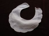 White cotton hand stitched infant bib
