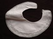 Pale pink cotton hand stitched infant bib