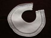 White cotton hand stitched infant bib