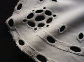 Table runner with embroidered geometrical motif