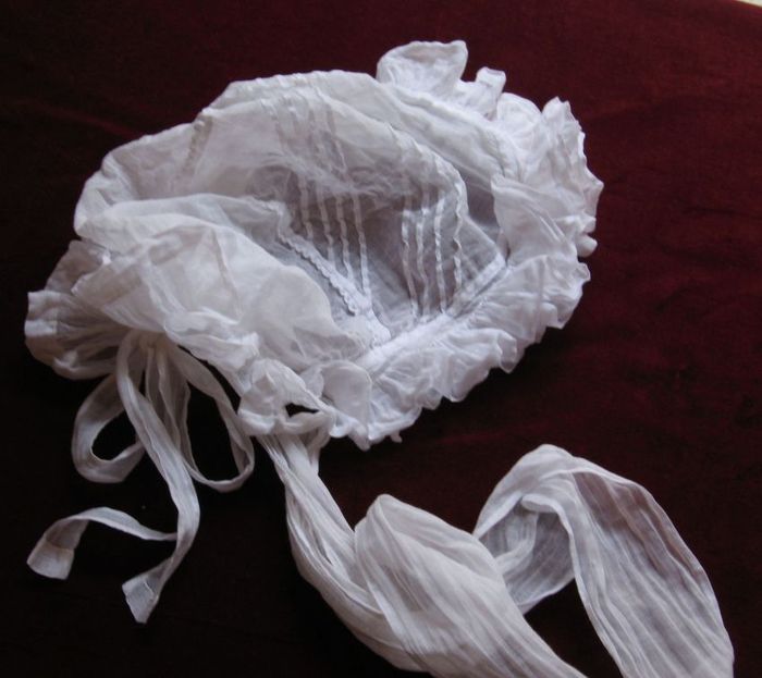 Young girl's bonnet in a whisper of white