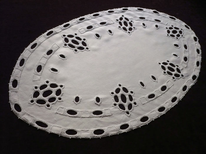 Table runner with embroidered geometrical motif